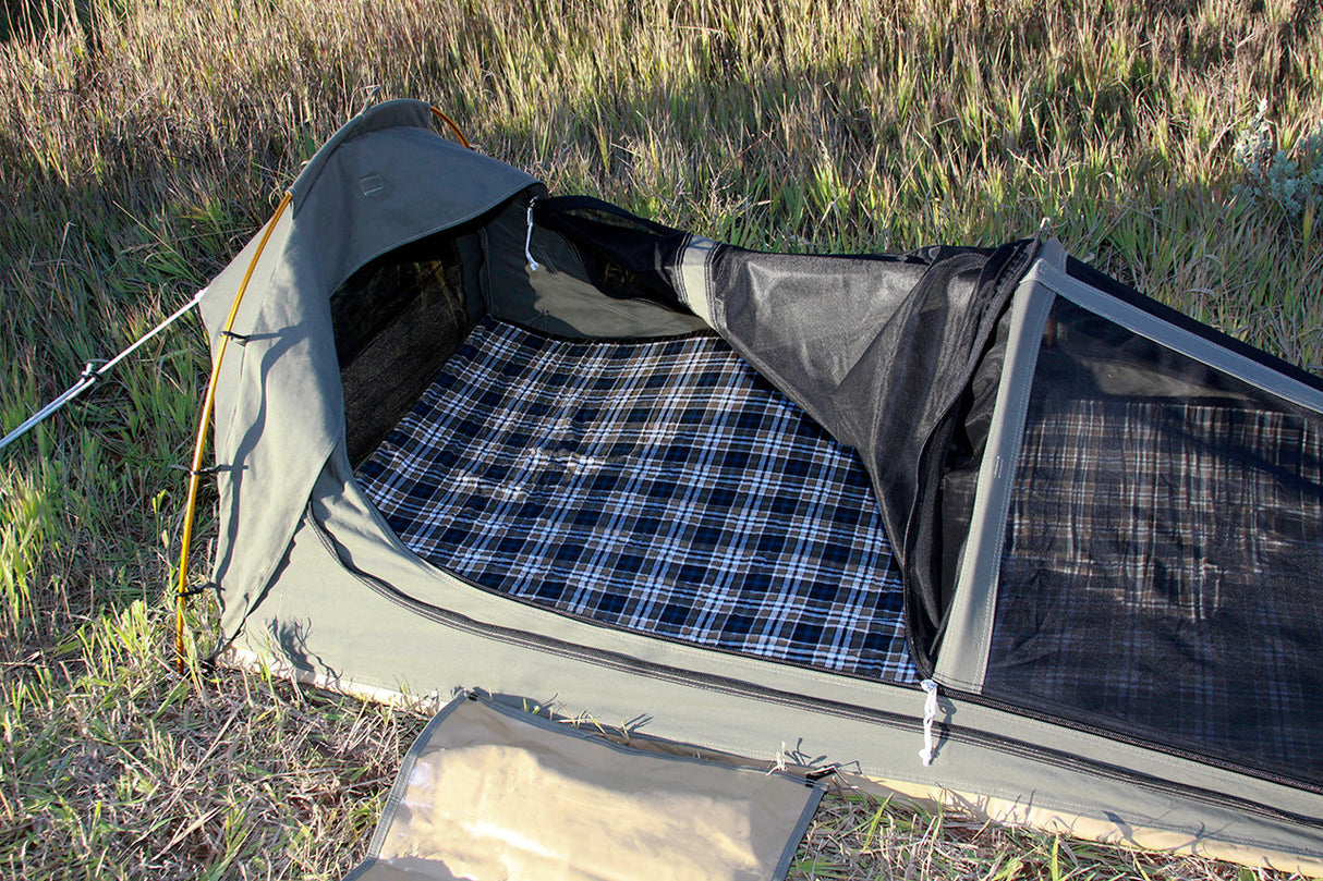 Ultralight green camping tent with plaid floor, featuring mesh windows for ventilation and easy setup.