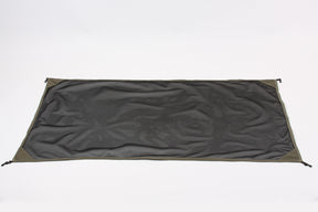 Durable black mesh tarp with olive green edges, ideal for camping and outdoor use.