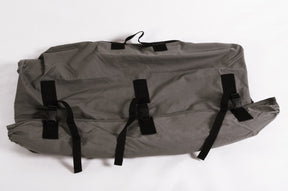Gray outdoor storage bag, durable material, featuring adjustable straps for secure closure and easy transport.