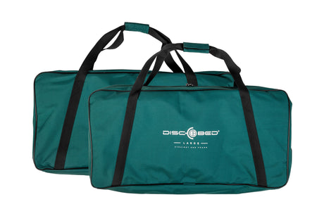 Two large teal storage bags with black handles for Disc-O-Bed gear.