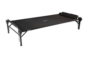 Black folding camp cot with sturdy metal frame and comfortable sleeping surface for outdoor use.