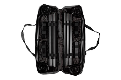 Black carrying case for portable equipment with wheels and sturdy straps, featuring organized interior compartments.