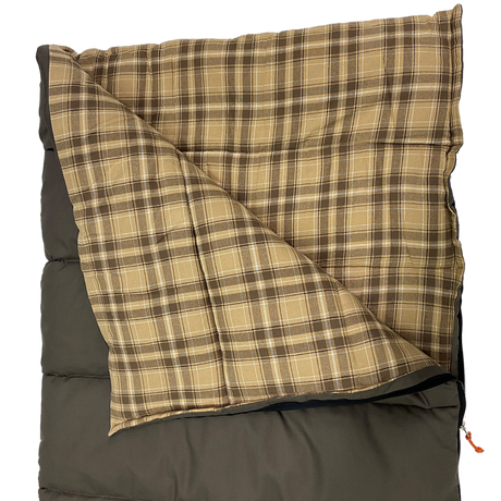 Plaid flannel sleeping bag, brown and beige, warm and cozy for camping or outdoor use.