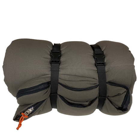 Compact gray travel pillow with zipper pockets and adjustable straps for easy carry.