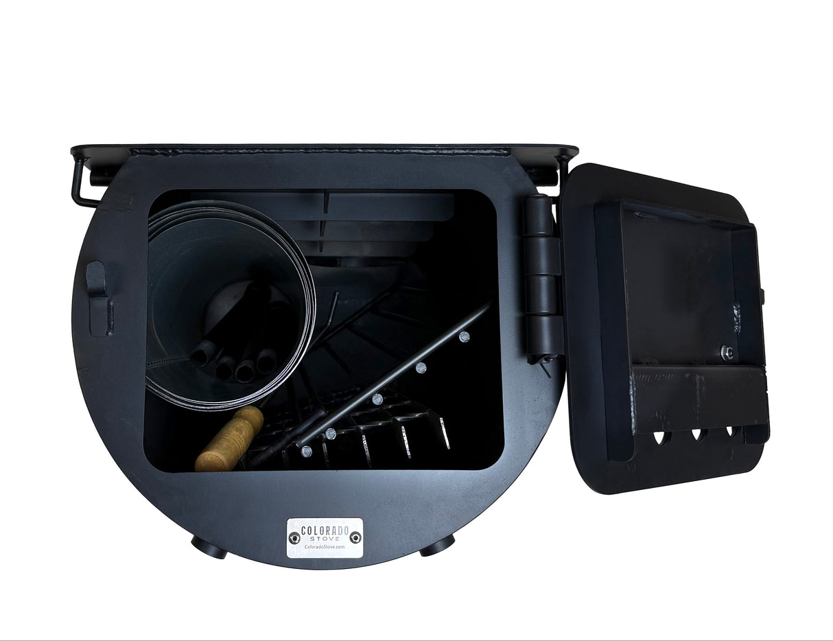 Stove with door open and parts loaded inside cylinder