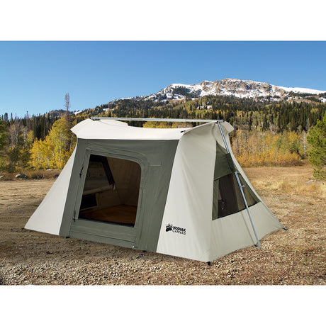 Spacious Kodiak Canvas tent in olive green and cream, ideal for camping, featuring large windows and easy setup.