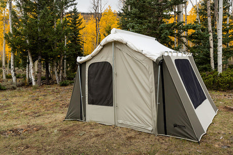 Kodiak Canvas tent in sage green, durable weather-resistant material, perfect for camping and outdoor use.