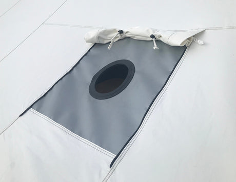 Image showing a close-up of the stove jack on the roof of the cabin lodge tents. The stove jack is open in this picture. 