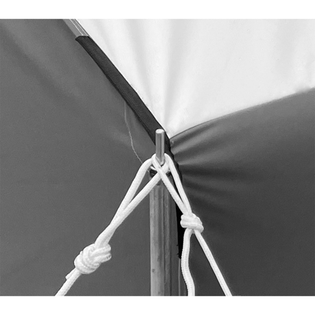 closeup of the corner of a cabin lodge tent showing guy rope attachments