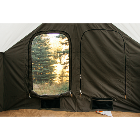 Interior view of a dark green camping tent with large windows and zippered openings.