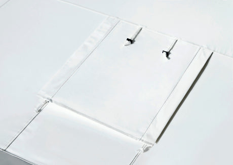 White fabric storage cover with black ties for secure closure, perfect for organization.