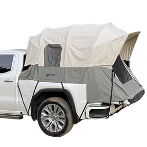 Kodiak Canvas truck camping tent, beige and gray, durable material, features quick setup and spacious interior for camping.
