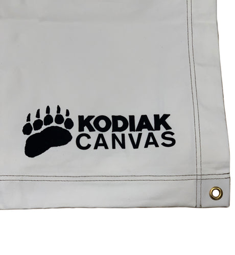 White Kodiak Canvas with black logo, durable, waterproof material, ideal for outdoor use.