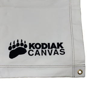 Kodiak Canvas tarp, durable white material with black logo and grommet for easy attachment.