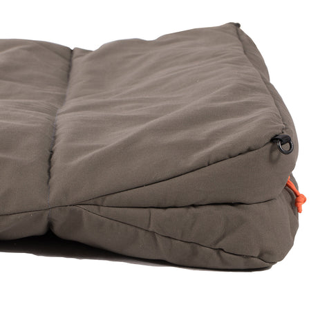 Comfortable brown camping pad, durable cotton fabric with orange strap, perfect for outdoor relaxation.