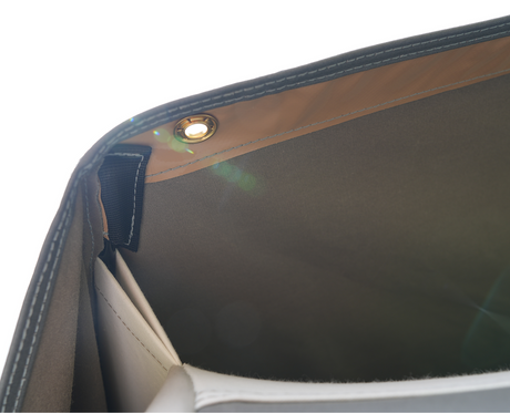 Interior of a gray tote bag showing sleek design and spacious compartments.