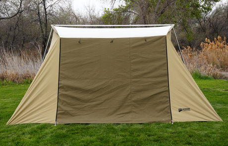Kodiak Canvas tent in olive green, durable fabric, ideal for camping and outdoor activities.