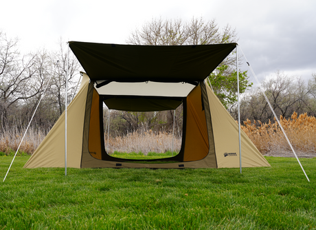 Outdoor camping tent in khaki and green, spacious with a sunshade, suitable for various weather conditions.