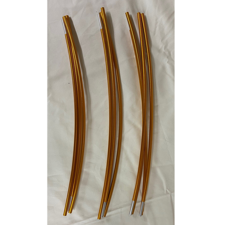Set of three curved golden metal rods with silver tips on a white background.